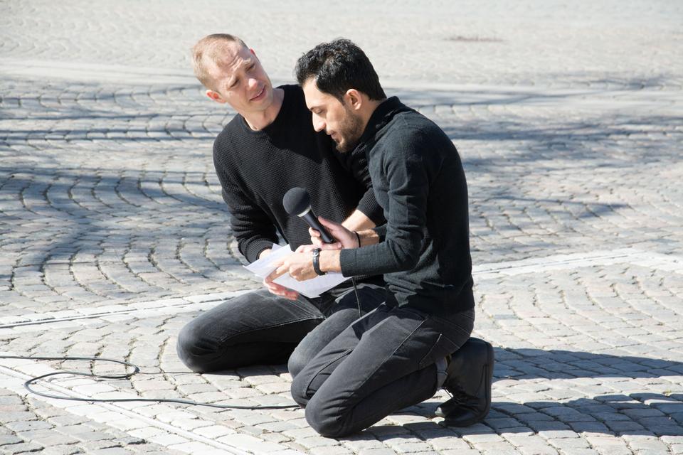 Ali Thareb, ICORN writer in residence in Jönköping, reads with Kalle Malmberg in The Square, Värnamo Sweden, April 2020. © Peter Lundstedt. Photo.
